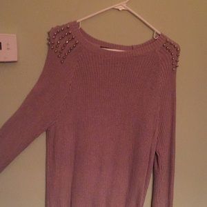 Tan sweater with spikes on the shoulders